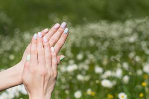 http://www.dreamstime.com/stock-photos-neat-manicure-short-nails-background-field-gentle-summer-image171813033